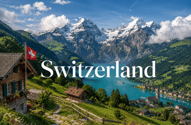 Snow-covered Swiss Alps with lakes, villages, and green meadows under sunlight