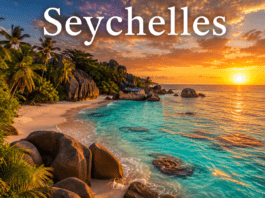 Tropical beach with turquoise ocean water and granite rocks in Seychelles at sunset