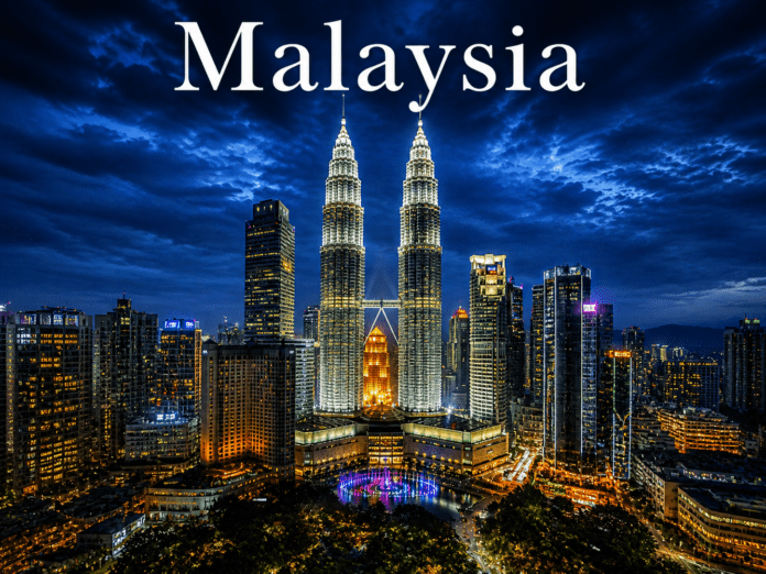 Malaysia Kuala Lumpur skyline Petronas Twin Towers night city lights reflection view